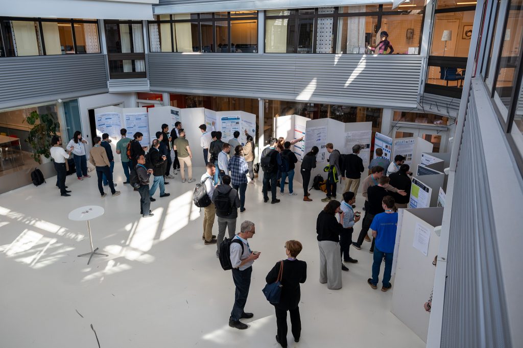 People infront of a poster session.